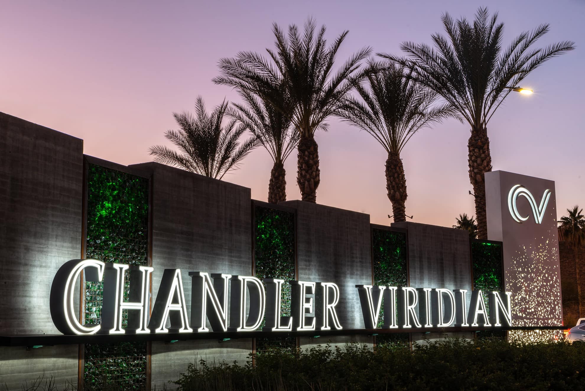 Hines Chandler Viridian Sign glowing during sundown