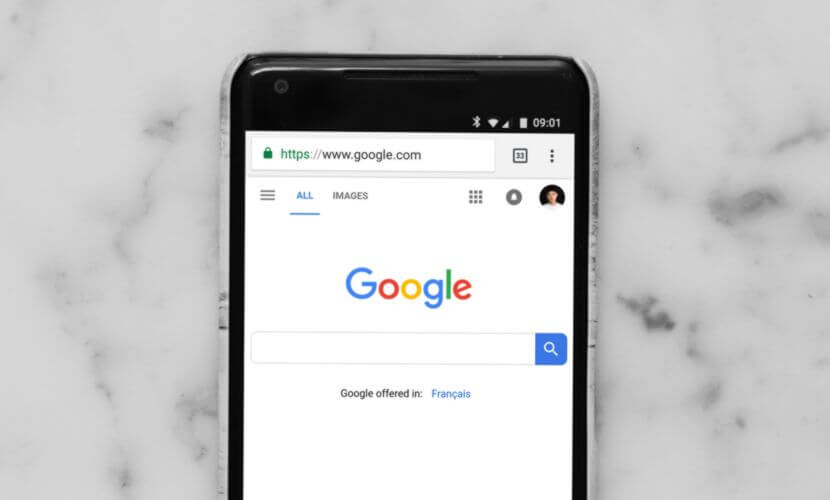 A smartphone lying on a countertop with Google SEO up